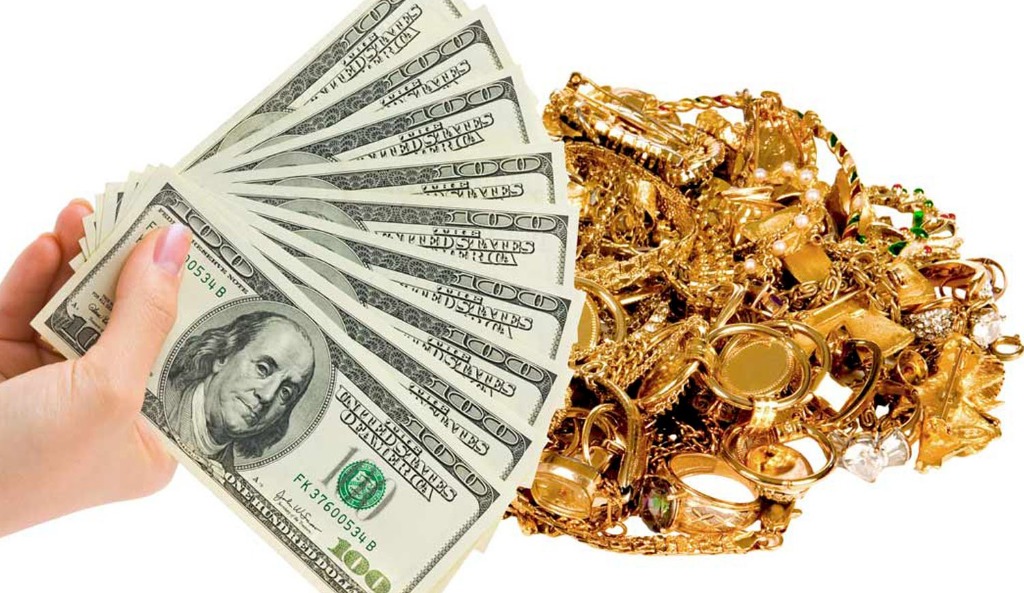 Hand holding cash next to gold jewelry and valuables - We buy gold in Secaucus NJ